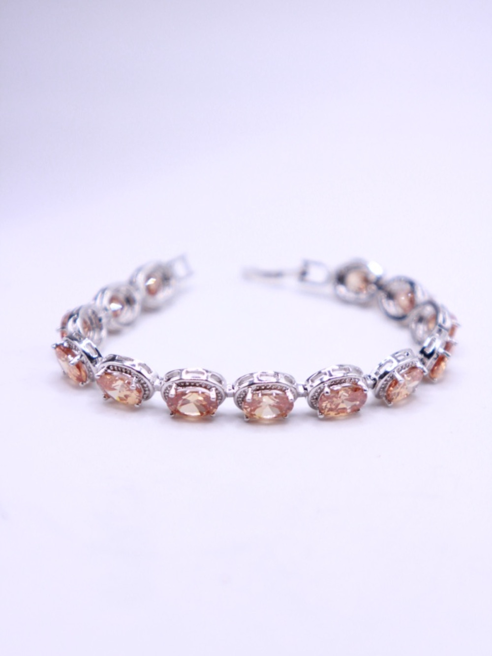 Silver tone Bracelet with Light Topaz tone CZ Accents 6.5” on cone